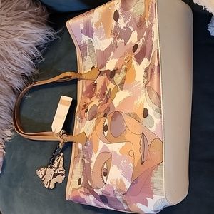 W Capsule large faces tote with inner pouch.